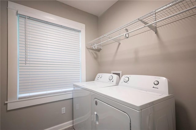 4219 Kenwood Ave, Kansas City, MO 64110 - washroom featuring washing machine and dryer