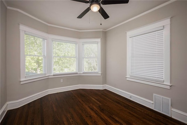 4219 Kenwood Ave, Kansas City, MO 64110 - unfurnished room with dark wood-style flooring, a ceiling fan, and ornamental molding