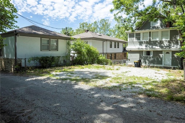 4219 Kenwood Ave, Kansas City, MO 64110 - rear view of house with stucco siding