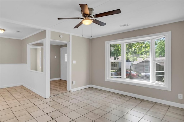 712 NE 45th St, Kansas City, MO 64116 - spare room featuring a ceiling fan, baseboards, and ornamental molding