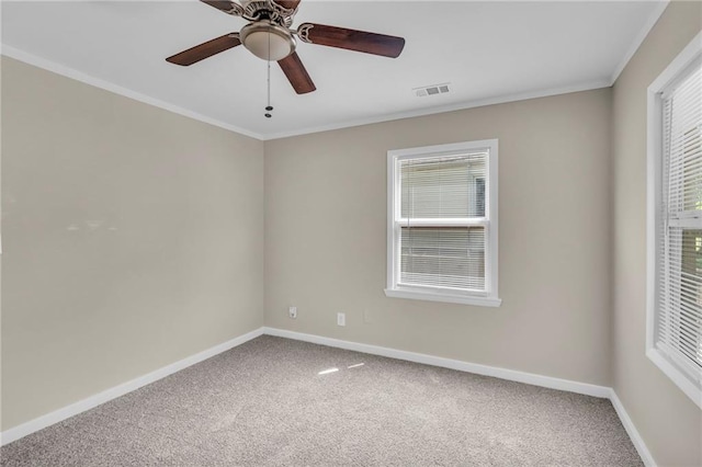 712 NE 45th St, Kansas City, MO 64116 - carpeted empty room featuring baseboards, crown molding, healthy amount of natural light, and a ceiling fan
