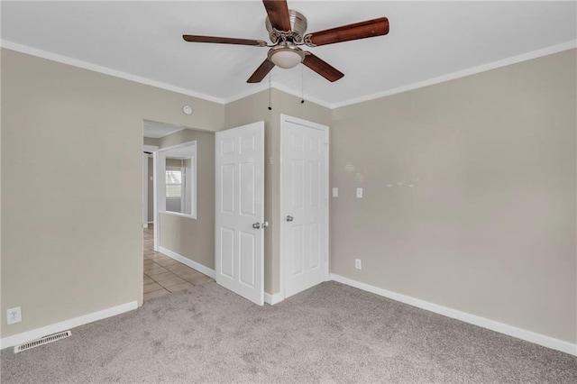 712 NE 45th St, Kansas City, MO 64116 - unfurnished bedroom with carpet floors, ornamental molding, baseboards, and a ceiling fan