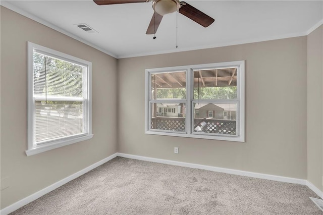 712 NE 45th St, Kansas City, MO 64116 - carpeted empty room featuring a ceiling fan, baseboards, and ornamental molding