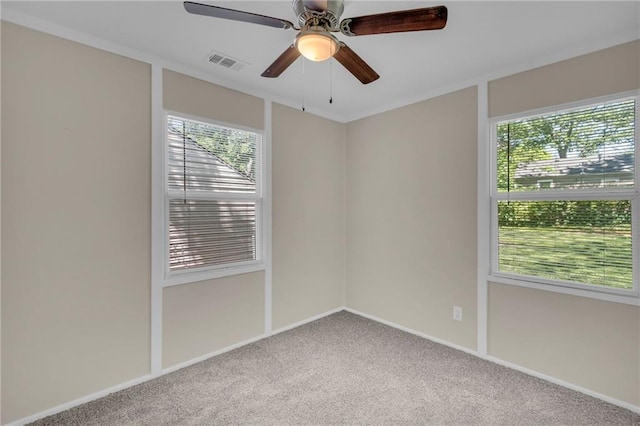 712 NE 45th St, Kansas City, MO 64116 - carpeted spare room featuring plenty of natural light, a ceiling fan, and baseboards