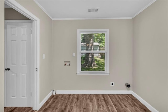 712 NE 45th St, Kansas City, MO 64116 - laundry area with washer hookup, wood finished floors, hookup for an electric dryer, baseboards, and crown molding