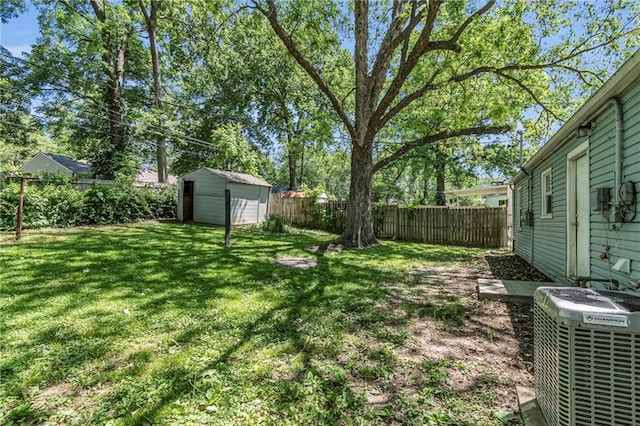 712 NE 45th St, Kansas City, MO 64116 - view of yard with central AC unit, a shed, and an outdoor structure