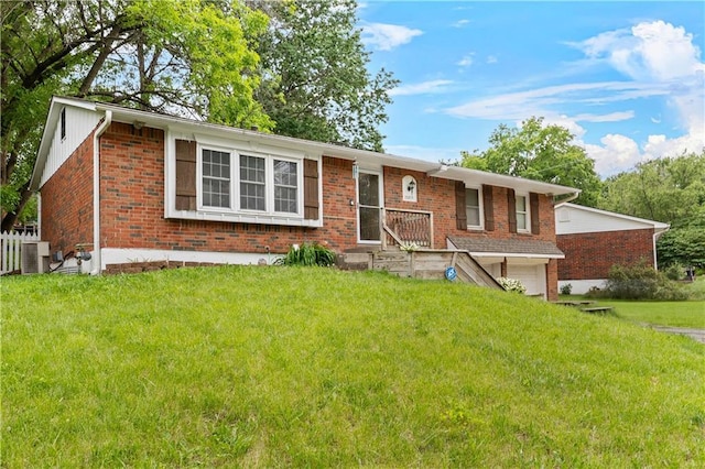 15205 E 40th St S, Independence, MO 64055 - single story home with brick siding, a front lawn, a garage, and central AC