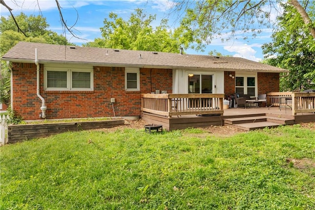 15205 E 40th St S, Independence, MO 64055 - rear view of property featuring brick siding, a yard, and a wooden deck