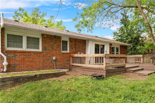15205 E 40th St S, Independence, MO 64055 - back of property featuring brick siding, a deck, and a lawn