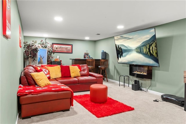 15205 E 40th St S, Independence, MO 64055 - carpeted living room featuring recessed lighting, a glass covered fireplace, and baseboards