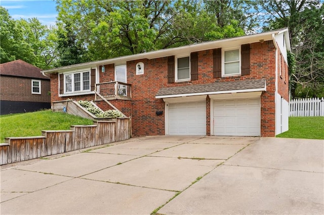 15205 E 40th St S, Independence, MO 64055 - view of front facade featuring brick siding, a garage, and concrete driveway