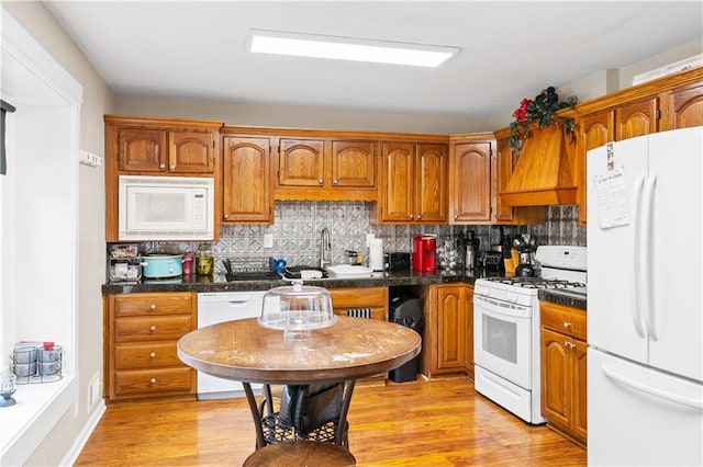 15205 E 40th St S, Independence, MO 64055 - kitchen featuring white appliances and brown cabinetry