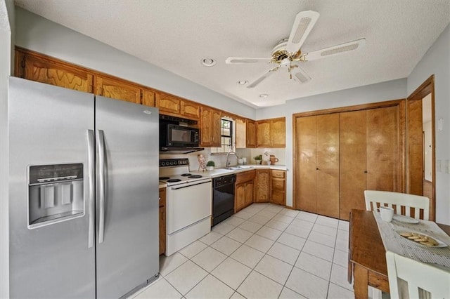 12332 W 105th Ter, Overland Park, KS 66215 - kitchen with black appliances, brown cabinets, a sink, ceiling fan, and light countertops