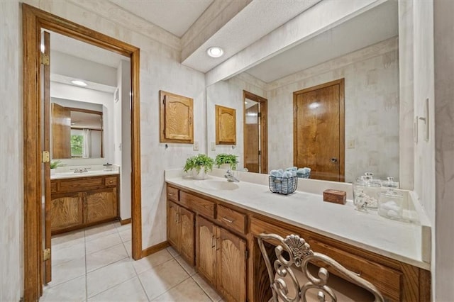 12332 W 105th Ter, Overland Park, KS 66215 - full bathroom with vanity, tile patterned floors, and baseboards