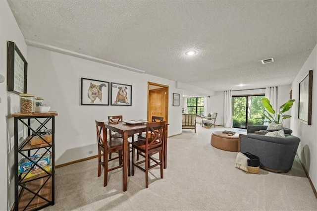 12332 W 105th Ter, Overland Park, KS 66215 - carpeted dining room featuring a textured ceiling and baseboards