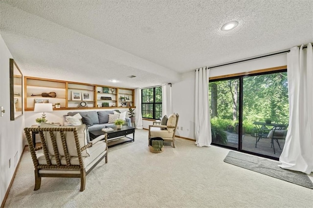 12332 W 105th Ter, Overland Park, KS 66215 - carpeted living area featuring a textured ceiling, baseboards, and recessed lighting
