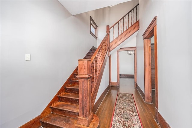 915 Main St, Neodesha, KS 66757 - stairs featuring wood finished floors and baseboards