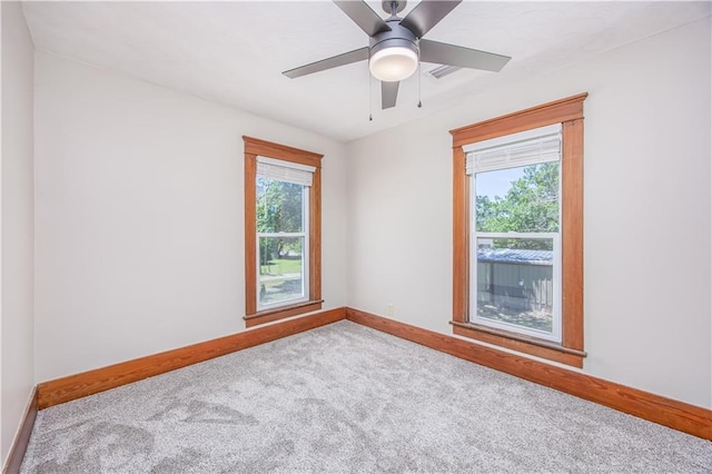 915 Main St, Neodesha, KS 66757 - carpeted empty room with baseboards and ceiling fan