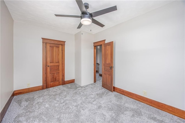 915 Main St, Neodesha, KS 66757 - carpeted empty room with a ceiling fan and baseboards