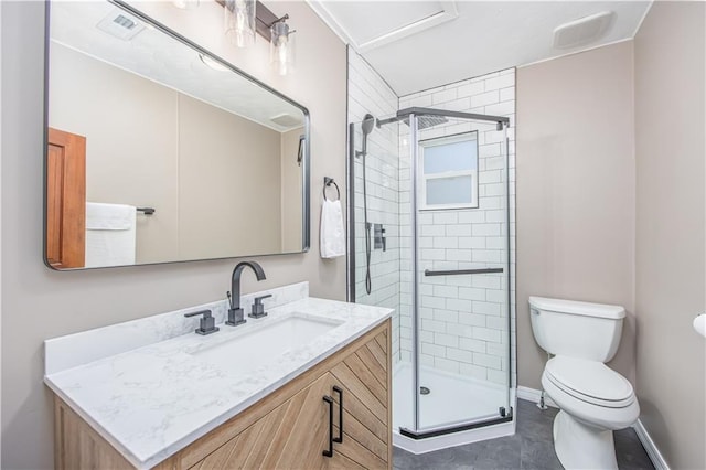 915 Main St, Neodesha, KS 66757 - bathroom with toilet, vanity, a stall shower, and baseboards