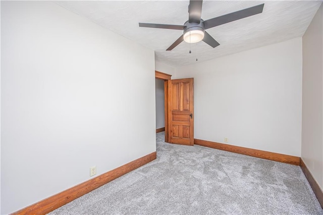 915 Main St, Neodesha, KS 66757 - unfurnished room featuring carpet flooring, baseboards, and a ceiling fan