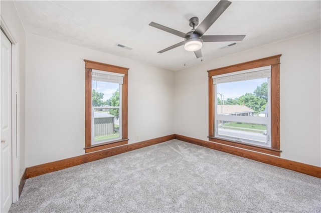 915 Main St, Neodesha, KS 66757 - carpeted empty room with baseboards, healthy amount of natural light, and ceiling fan