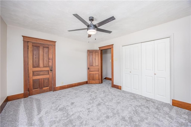 915 Main St, Neodesha, KS 66757 - bedroom featuring baseboards, carpet floors, a closet, and a ceiling fan