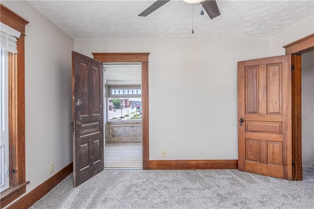 915 Main St, Neodesha, KS 66757 - unfurnished room featuring carpet flooring, ceiling fan, and baseboards