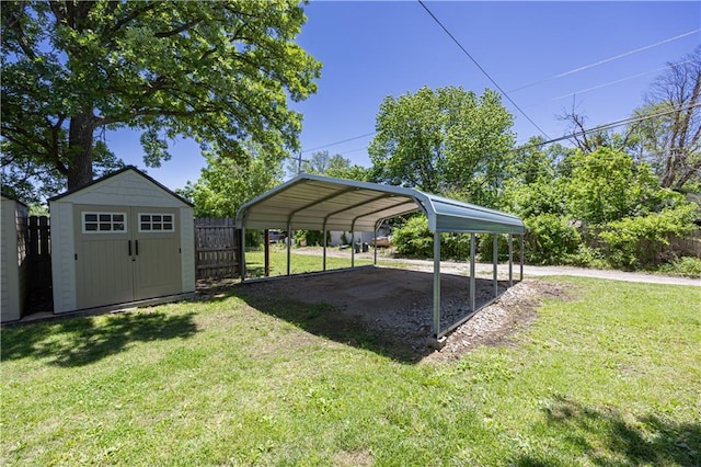 915 Main St, Neodesha, KS 66757 - view of grassy yard with a detached carport and driveway