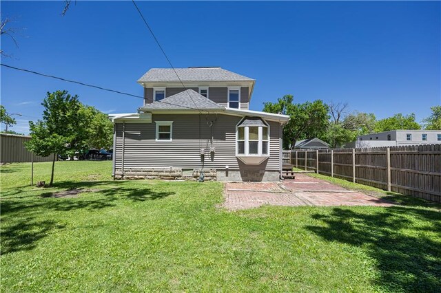915 Main St, Neodesha, KS 66757 - back of house featuring a patio area and crawl space