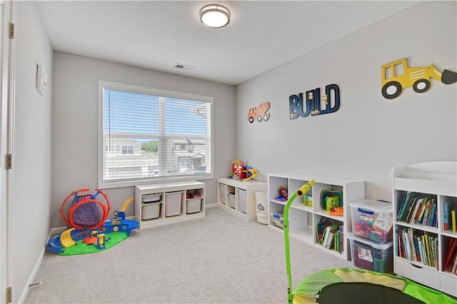 19629 W 196th St, Spring Hill, KS 66083 - recreation room with carpet flooring, a textured ceiling, and baseboards