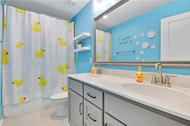 19629 W 196th St, Spring Hill, KS 66083 - bathroom featuring toilet, double vanity, tile patterned floors, and shower / tub combo with curtain