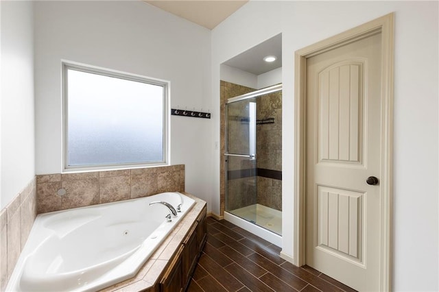 24318 W 91st Pl, Lenexa, KS 66227 - bathroom with a shower stall, a jetted tub, and wood finished floors