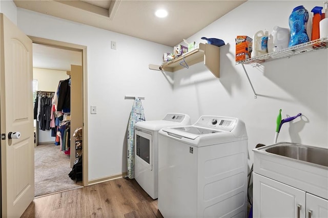 24318 W 91st Pl, Lenexa, KS 66227 - washroom featuring washing machine and clothes dryer, cabinet space, wood finished floors, recessed lighting, and baseboards