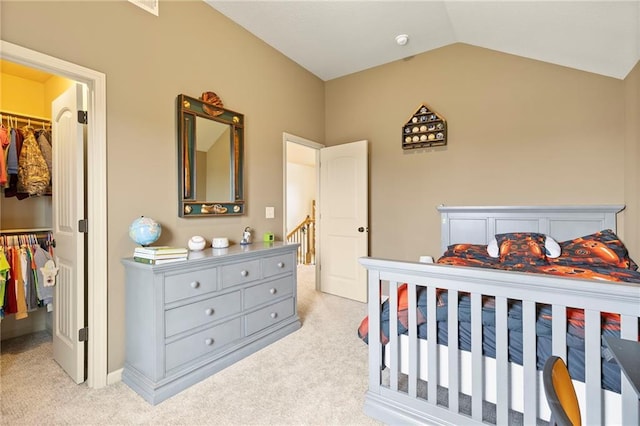 24318 W 91st Pl, Lenexa, KS 66227 - carpeted bedroom with a walk in closet, a closet, and lofted ceiling