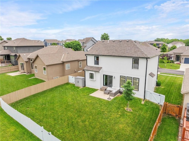 24318 W 91st Pl, Lenexa, KS 66227 - rear view of property featuring a gate, a residential view, outdoor lounge area, a patio area, and roof with shingles