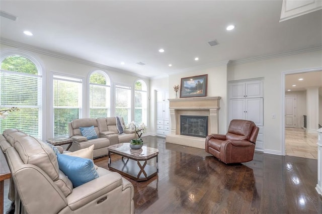 3109 W 118th St, Leawood, KS 66211 - living area featuring plenty of natural light, recessed lighting, a glass covered fireplace, crown molding, and wood finished floors