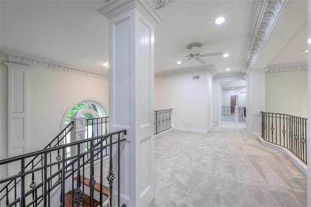 3109 W 118th St, Leawood, KS 66211 - corridor with an upstairs landing, decorative columns, carpet floors, recessed lighting, and crown molding
