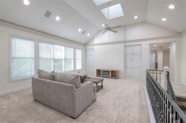 3109 W 118th St, Leawood, KS 66211 - living area featuring light colored carpet, a skylight, recessed lighting, plenty of natural light, and lofted ceiling