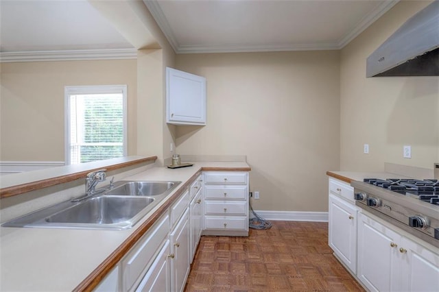 3109 W 118th St, Leawood, KS 66211 - kitchen with crown molding, white cabinetry, exhaust hood, light countertops, and stainless steel gas stovetop