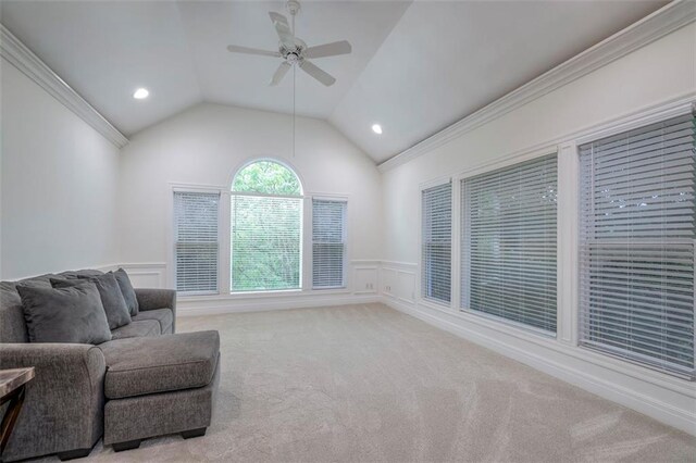 3109 W 118th St, Leawood, KS 66211 - living area featuring ceiling fan, a wainscoted wall, carpet floors, ornamental molding, and lofted ceiling