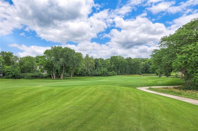 3109 W 118th St, Leawood, KS 66211 - view of home's community with view of wooded area, a lawn, and view of golf course