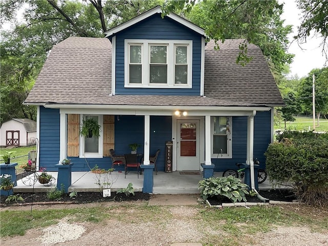 2302 3rd Ave, Leavenworth, KS 66048 - view of front of property with covered porch and roof with shingles