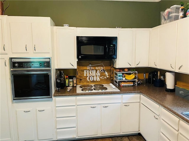 2302 3rd Ave, Leavenworth, KS 66048 - kitchen with black appliances, white cabinets, and dark countertops
