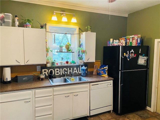 2302 3rd Ave, Leavenworth, KS 66048 - kitchen featuring white dishwasher, freestanding refrigerator, a sink, and white cabinets