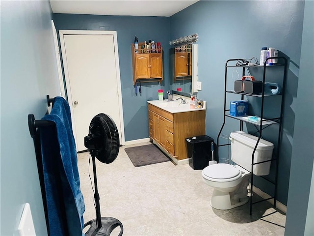 2302 3rd Ave, Leavenworth, KS 66048 - bathroom with vanity, toilet, and tile patterned floors