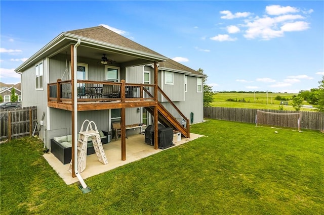 2808 E Cedar Pl, Tonganoxie, KS 66086 - rear view of house with ceiling fan, a deck, a patio, a shingled roof, and stairs
