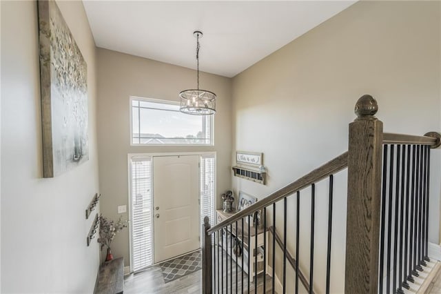 2808 E Cedar Pl, Tonganoxie, KS 66086 - foyer entrance with a chandelier and wood finished floors