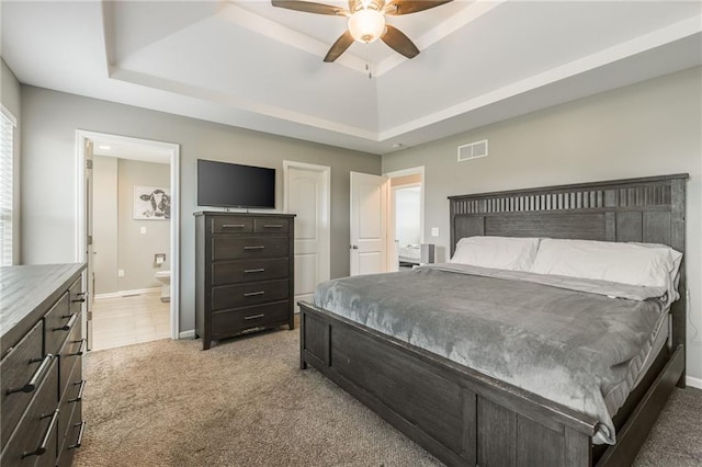 2808 E Cedar Pl, Tonganoxie, KS 66086 - bedroom featuring a raised ceiling, light carpet, and baseboards