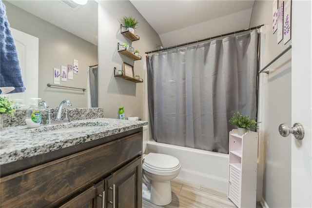 2808 E Cedar Pl, Tonganoxie, KS 66086 - bathroom featuring vanity, shower / bath combo, and toilet